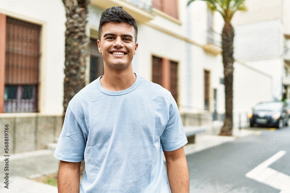 Young hispanic man smiling confident standing at street Young hispanic man smiling confident standing at street