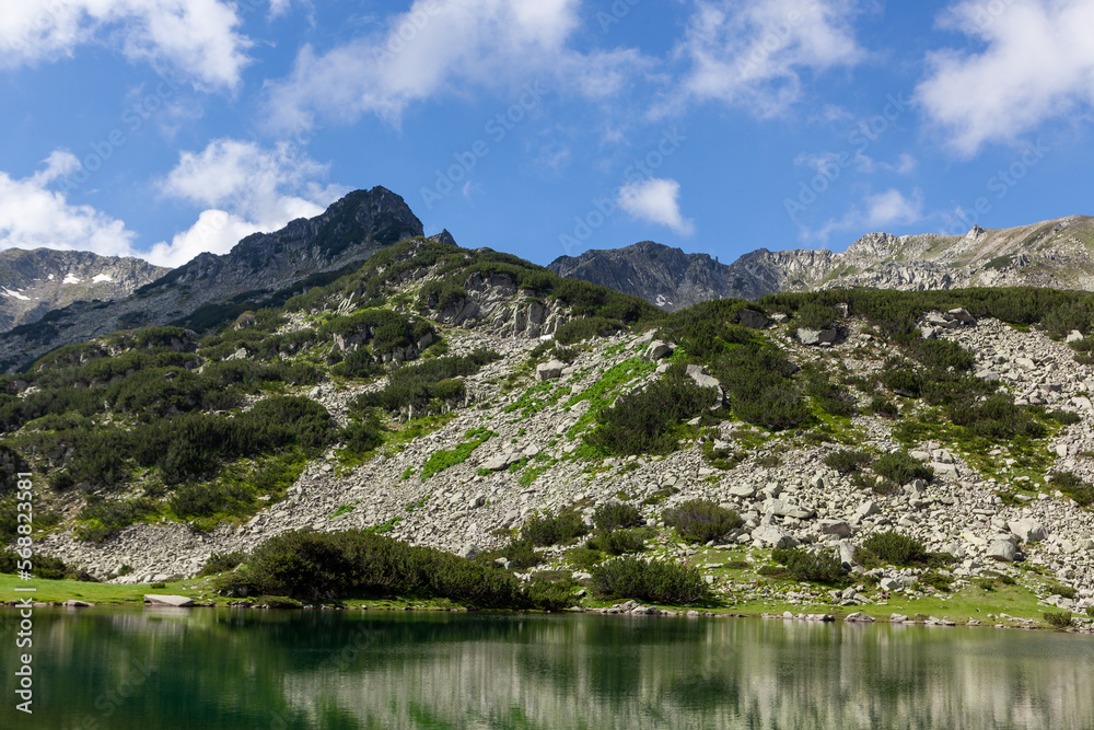 Mountain lake in Pirin National Park in Bulgaria. Beautiful landscape on the hiking trail to Vihren peak.