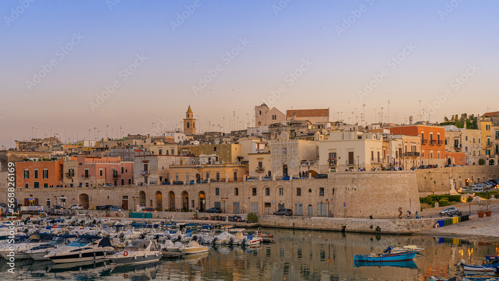 View of seafront and old town Bisceglie in Puglia on sunset.