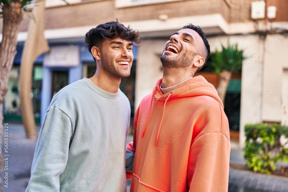 Two man couple standing together at street Two man couple standing together at street