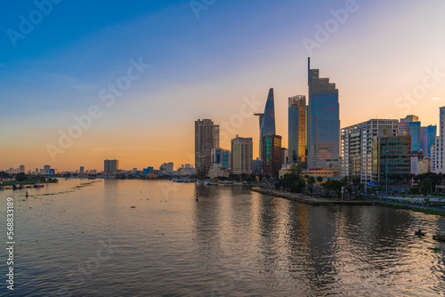 Ho Chi Minh City, Viet Nam 02 Jan 2023: Beautiful Sunset at district 1, view to Bitexco tower with Vietnam flag on the top building. One of the famous buildings in ho chi minh city