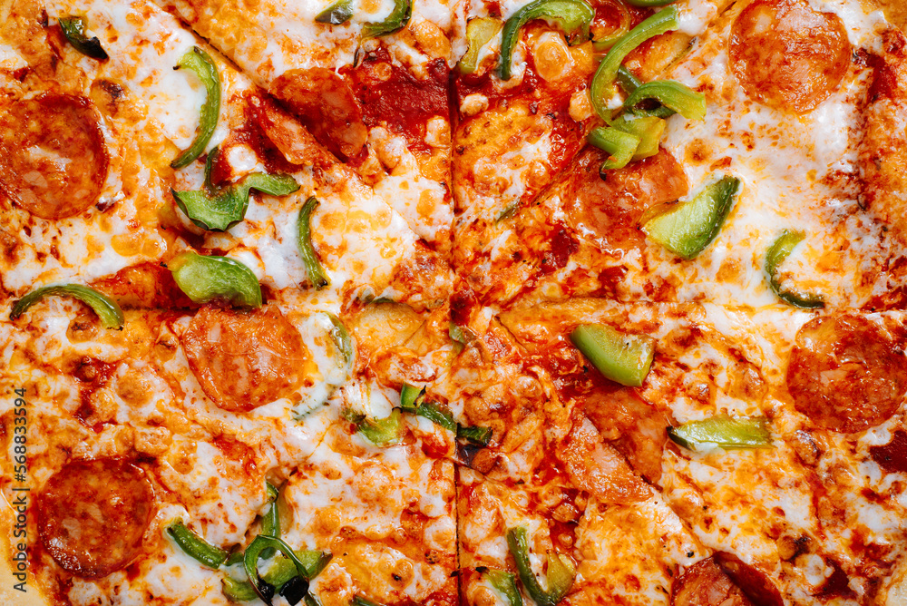 Fresh classic pizza with tomato sauce, mozzarella, spicy chorizo, bell peppers. Food textures top view, close-up Fresh classic pizza with tomato sauce, mozzarella, spicy chorizo, bell peppers. Food textures top view, close-up