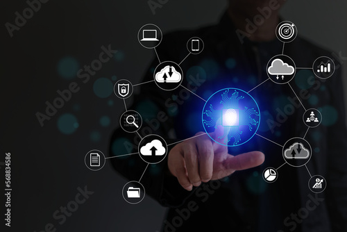 Businessman touching virtual screen with fingerprint icon connected to cloud icon for data preservation  online data storage concept from computer and smartphone on cloud  big data connection.
