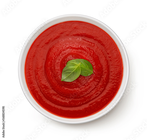 Obraz na plátně Bowl of tomato soup isolated on white background, top view