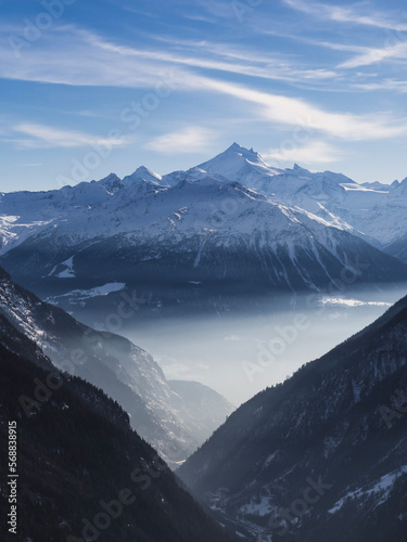 snow covered mountains with fog © Sascha