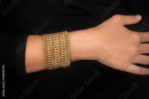 A lady's arm wearing a bracelet
