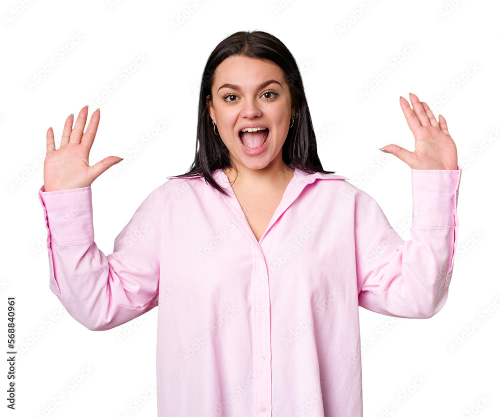 Young caucasian woman isolated receiving a pleasant surprise, excited and raising hands. Young caucasian woman isolated receiving a pleasant surprise, excited and raising hands.