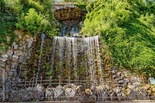 Budapest, Hungary - July 04, 2022: Small waterfall at the bottom of the Budapest Citadel. Waterfall in city park, Budapest.