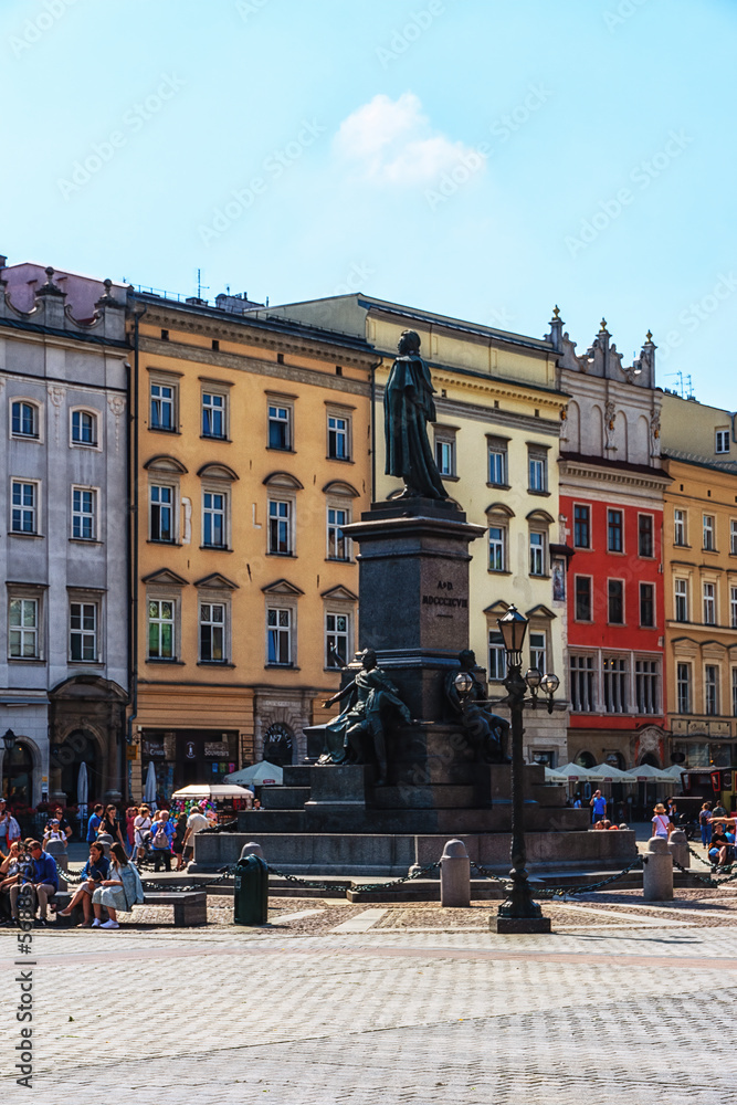 View of the main square in Krakow with the statue of Adamowi Narod