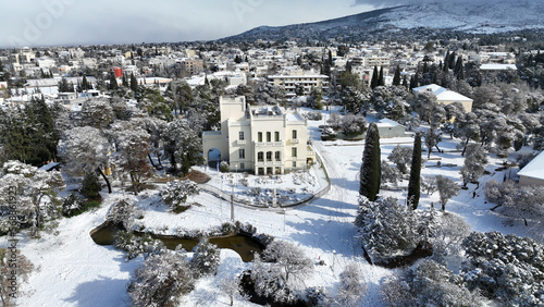 Aerial drone photo of beautiful park of Syggrou with rare trees and beautiful nature covered in snow as seen in winter, Marousi, North Athens, Greece photo