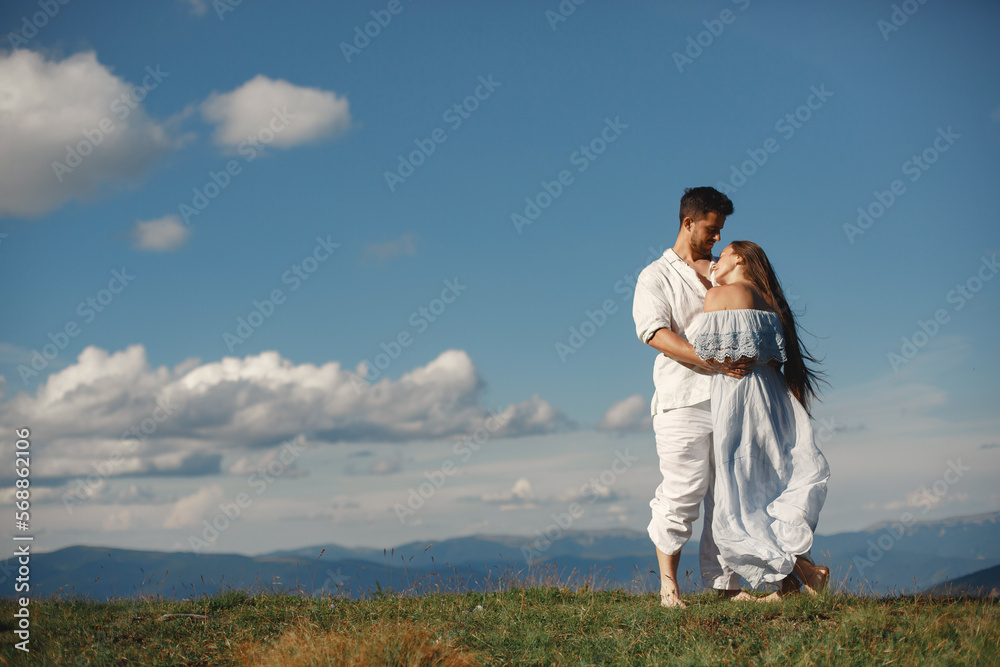 Couple walk in the mountains