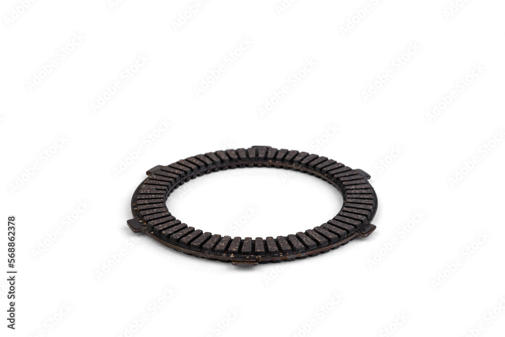 Spare part of motorcycle clutch plate isolated on white background.