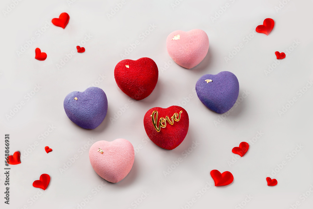 Cakes on lighte background.  Red, rose, violett hearts. Love and sweet concept. Valentine day. White background.