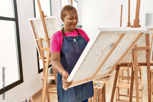 Senior african american woman smiling confident looking draw canvas at art studio