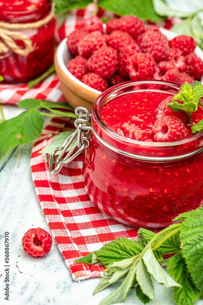 homemade raspberry jam or confiture on light background. vertical image. top view. place for text homemade raspberry jam or confiture on light background. vertical image. top view. place for text