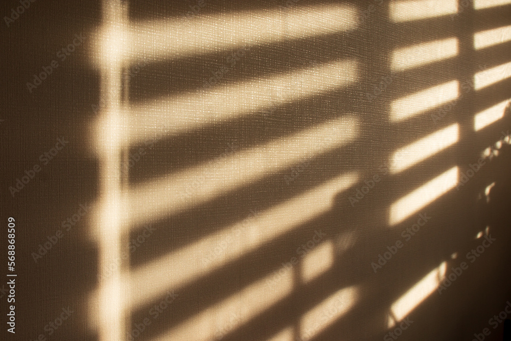 Sunlight and window blinds shadow on the wall. Sunlight and window blinds shadow on the wall.