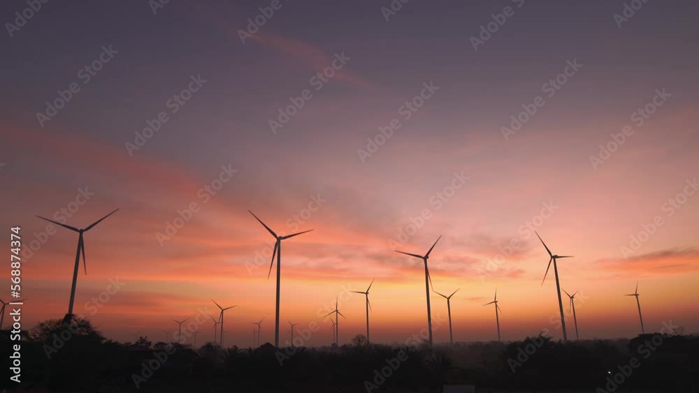 wind turbine in morning tropical forest at morning with constant air flow. sustainable energy source for smart cities.Wide angle shot. wind turbine in morning tropical forest at morning with constant air flow. sustainable energy source for smart cities.Wide angle shot.