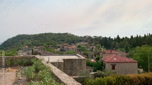 Footage of traditional, old historical houses in famous, touristic Aegean town called 