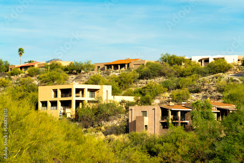 Row of modern mansions in the sonora desert with house and homes in the hills and moutain landscapes of arizona