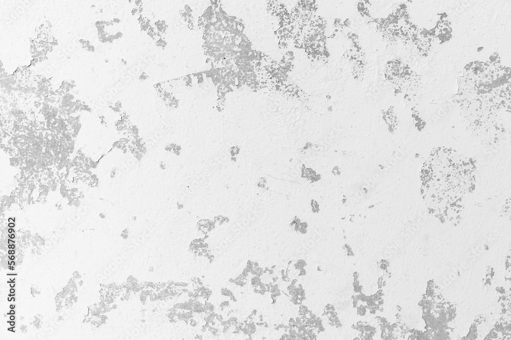 Old white cement wall with paint falling off