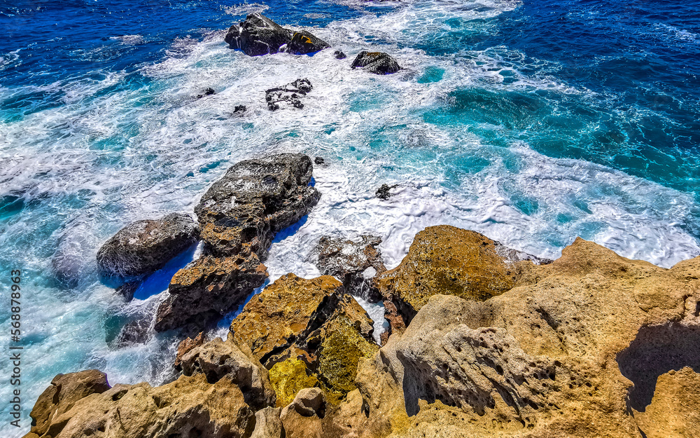 Beautiful rocks cliffs view waves at beach Puerto Escondido Mexico.