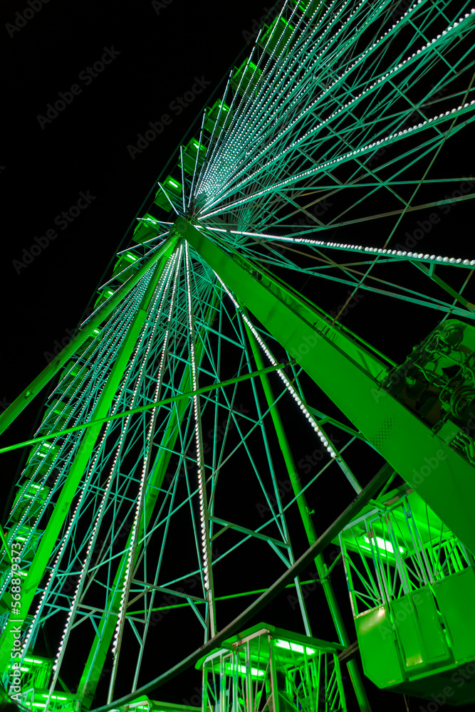Fototapeta premium photograph of Ferris wheel illuminated at night