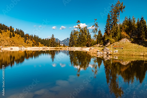 Fototapeta Naklejka Na Ścianę i Meble -  Beautiful alpine autumn or indian summer landscape shot with reflections in a pond at the famous Loferer Alm, Lofer, Salzburg, Austria