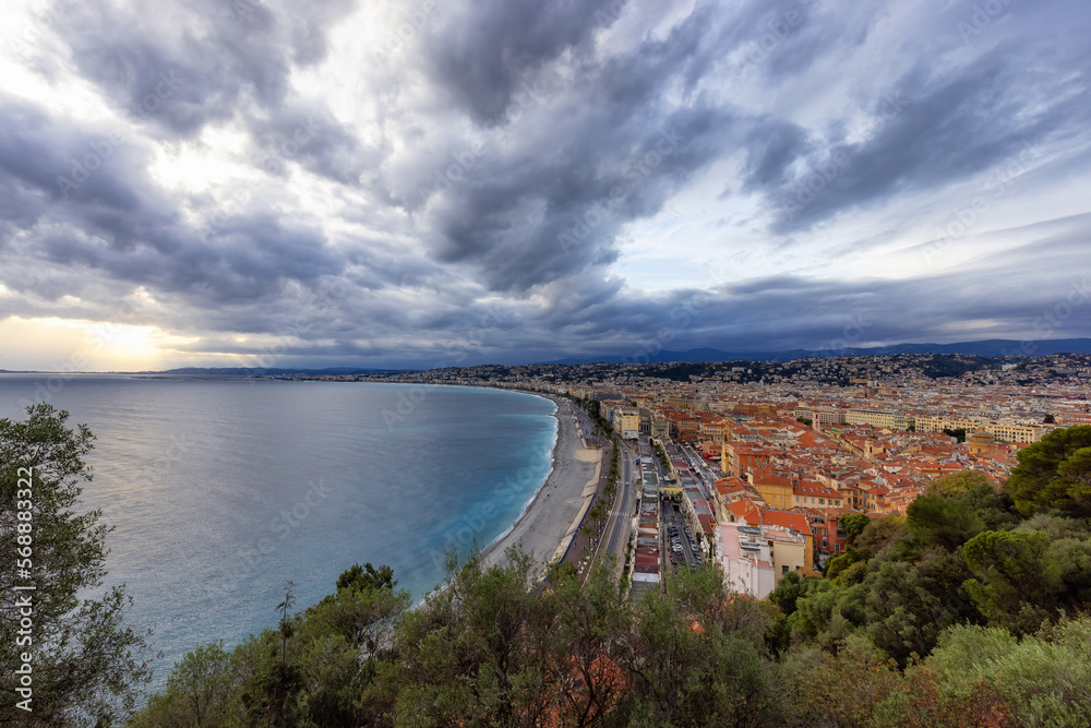 Sandy Beach by Historic City of Nice, France. View from Castle Hill. Cloudy Evening before Sunset. Wide Angle