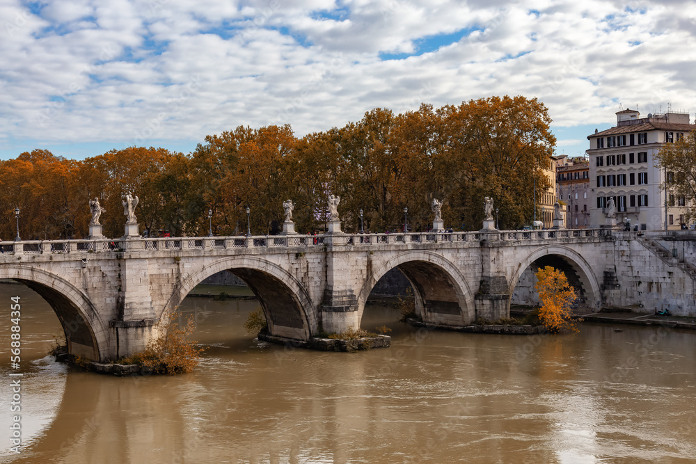 River Tiber and Bridge in a historic City, Rome, Italy. Sunny and Cloudy day.