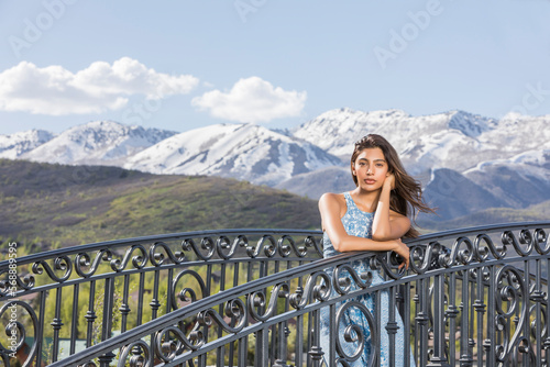 USA, Utah, Midway, Portrait of beautiful woman on footbridge in mountain scenery photo