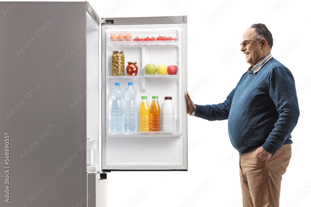 Corpulent mature man opening a fridge Corpulent mature man opening a fridge