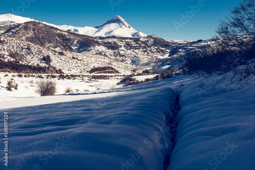 Panoramic view of Espigüete peak in the Eastern Mountain of Leon. Sunny day with snow