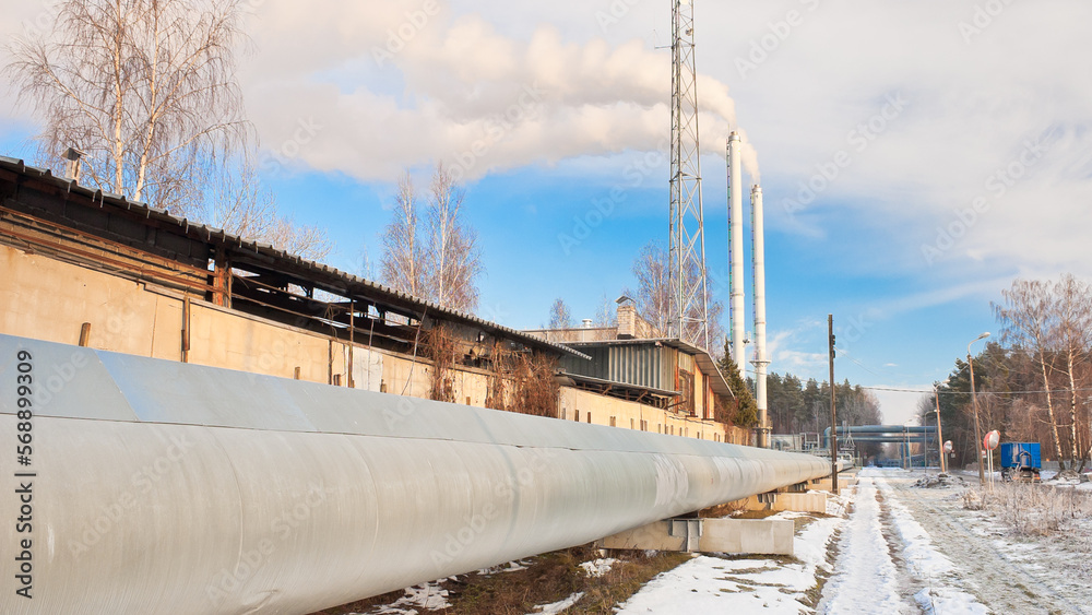pipeline and pipes of a thermal power plant, in the background a blue sky