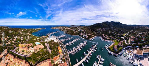 Italy, Sardegna island. Luxury resort Porto Cervo. Marina with sailing boats, aerial drone video view photo