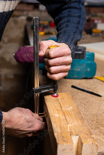 A carpenter works in a furniture workshop