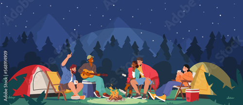 Young People Spend Time At Night Summer Camp In Deep Forest. Active Tourist Characters Sitting On Field With Tents