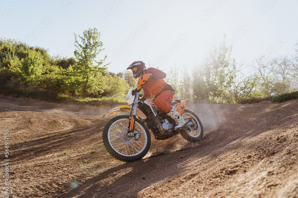 Man riding motorbike on motocross track.Extreme and Adrenaline. Motocross rider in action. Motocross sport. Active lifestyle