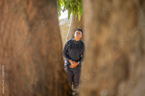 Portrait of a queer masculine black woman at the park