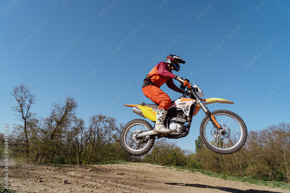 Man riding motorbike on motocross track.Extreme and Adrenaline. Motocross rider in action. Motocross sport. Active lifestyle