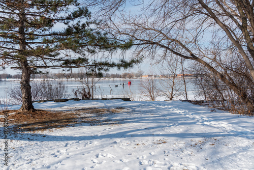 Ice Fishing On Fox River At De Pere, Wisconsin, In Early February photo