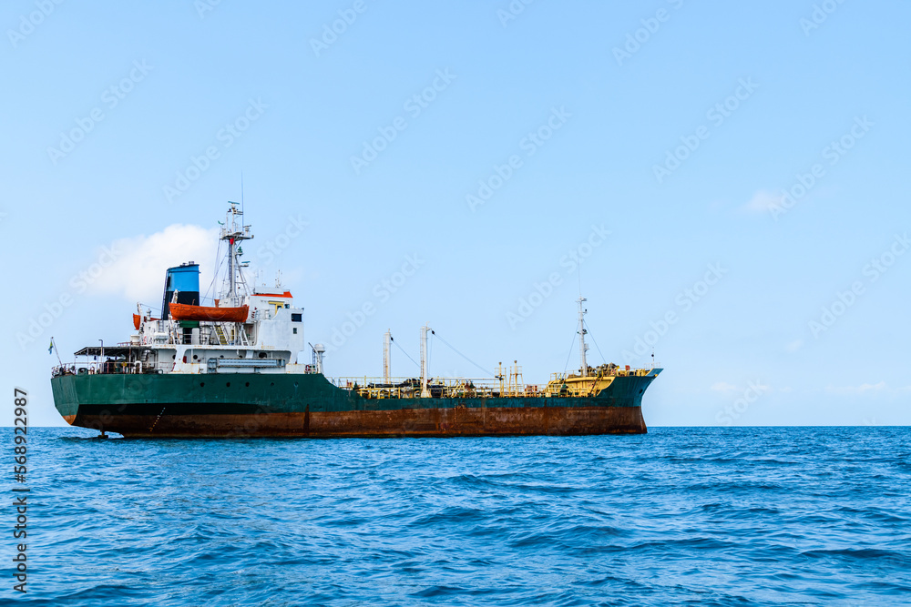 Cargo ship waiting near port of the Stone town. Zanzibar, Tanzania Cargo ship waiting near port of the Stone town. Zanzibar, Tanzania