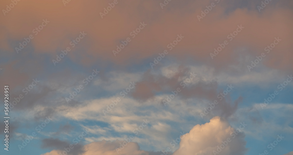 Beautiful orange bright sunset sky with dramatic clouds. Sunset sky background.