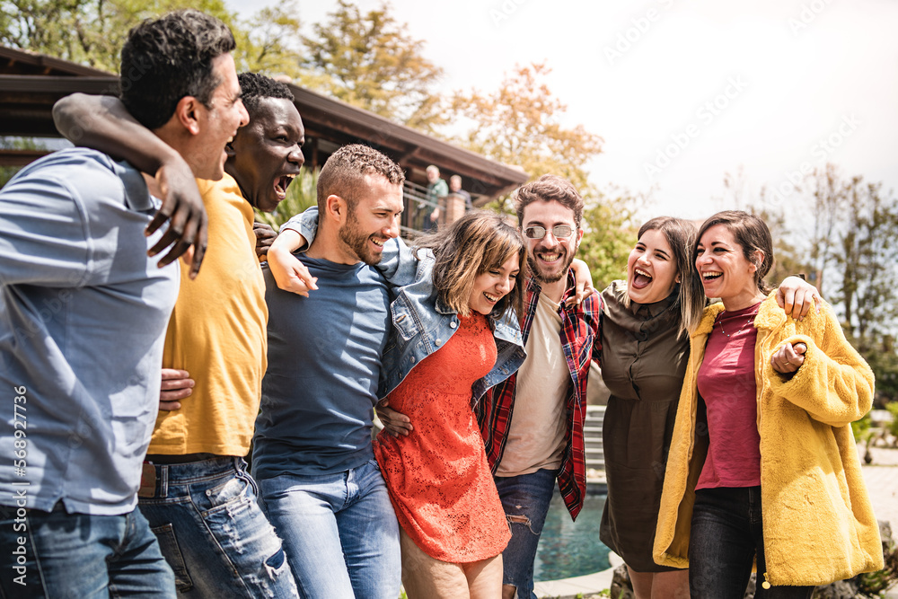 multiethnic group of friends embracing outdoors multiethnic group of friends embracing outdoors