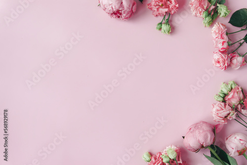 Photographie Peonies, roses on pink background with copy space
