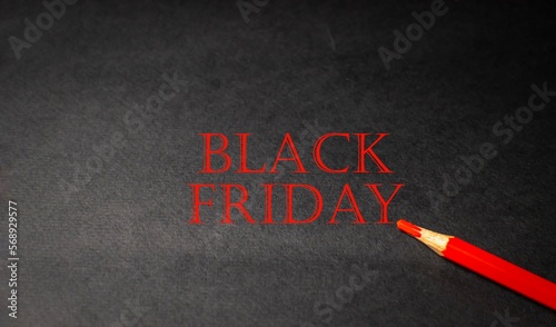 The concept of Black Friday, a day of discounts and sales. Red inscription on a black background 