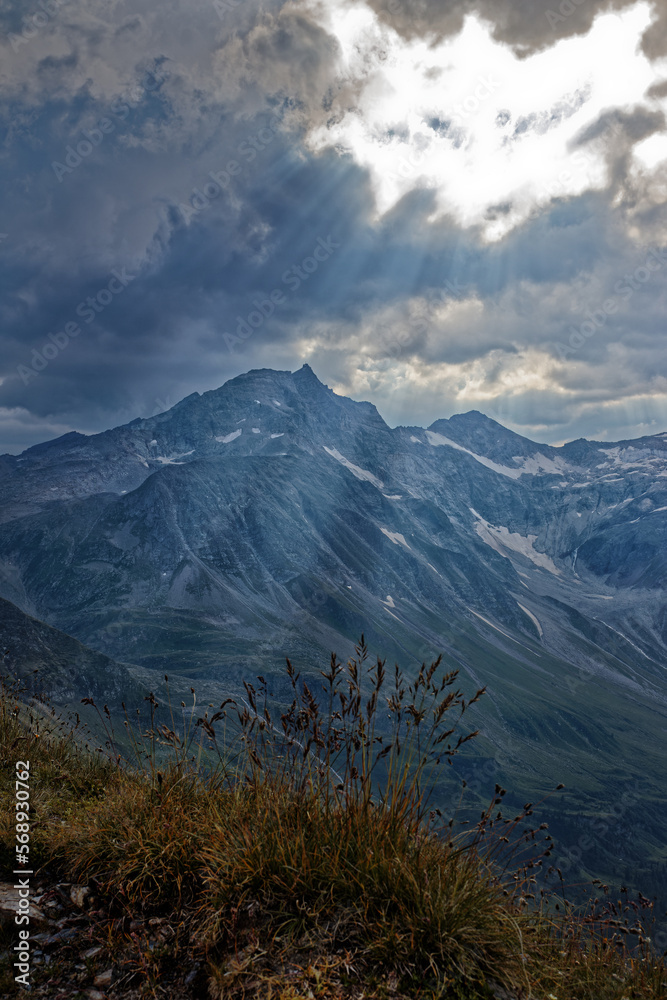 Dramatic light over the mountain Hoher Sonnblick with clouds, High Tauern National Park, Austrian Alps, Europe