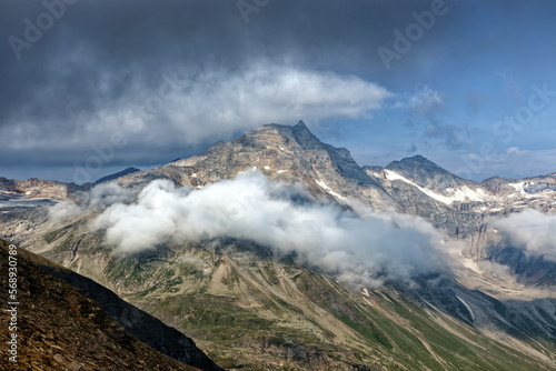 View to the mountain Hoher Sonnblick with clouds, High Tauern National Park, Austrian Alps, Europe