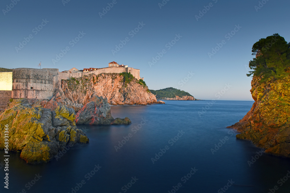 panoramic night view to the city skyline of Dubrovnik's Old City while sunset with dramatic sky, Croatia
