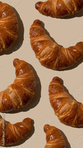 pattern of croissants on a light background. Baking concept