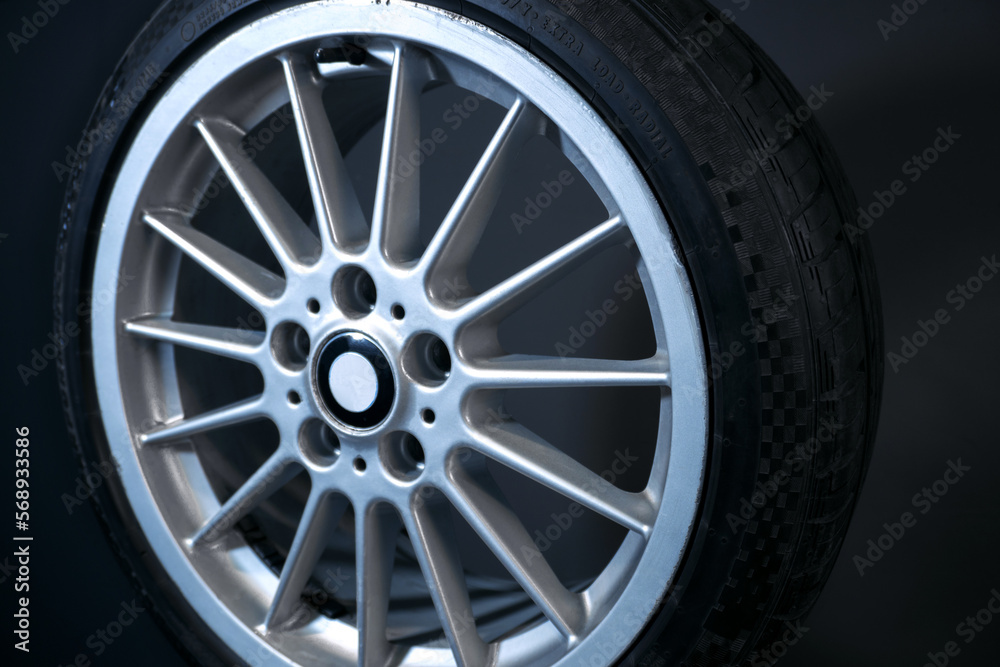 old car wheels titanium rims long exposure video on dark background spinning motion simulation